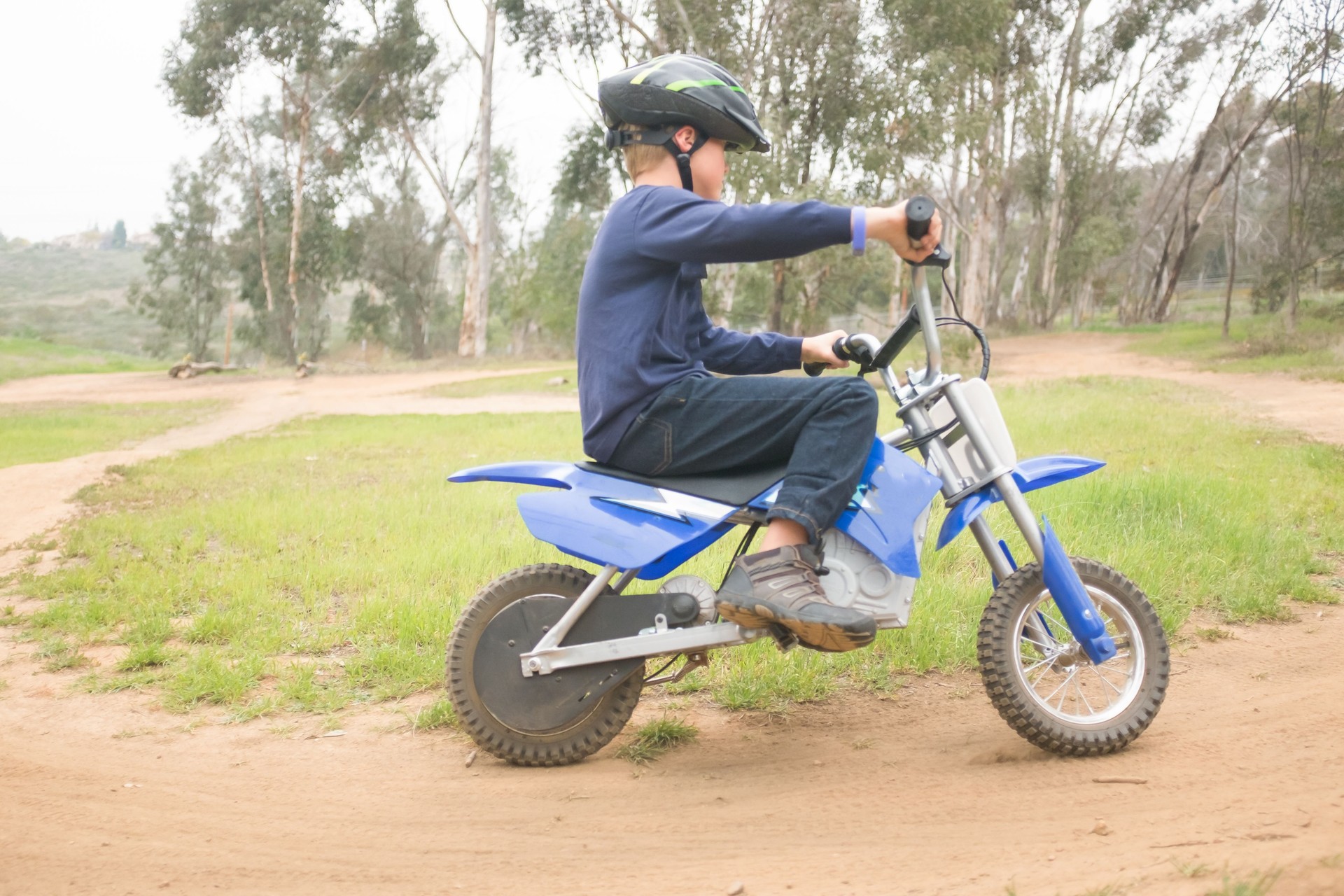 Young Boy Riding An Electric Motorcycle